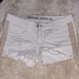 Distressed white jean shorts with lace